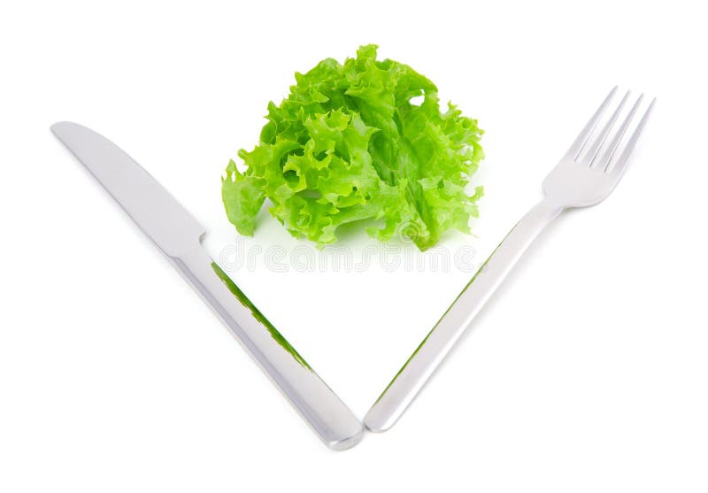 Leaves lettuce with fork and knife