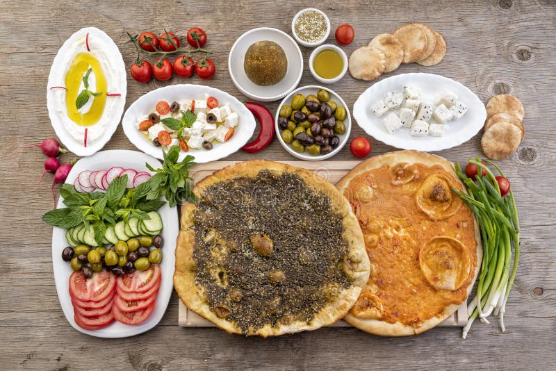 Lebanese food of Manakish, Lbaneh, cheeses, Vegetables and olives
