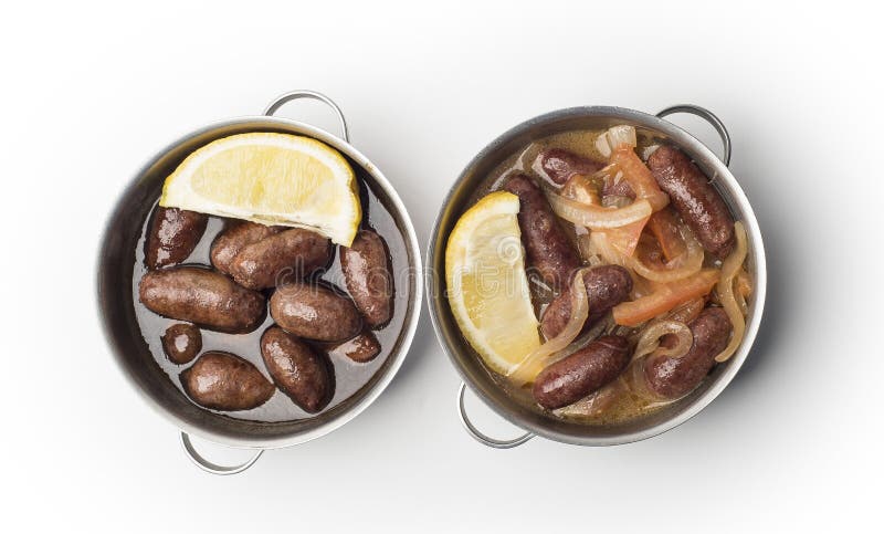 Lebanese starters of Makanek meat marinated, sausages fried in a metal pan