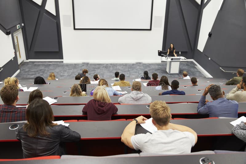 Lecture at university lecture theatre, audience POV royalty free stock image
