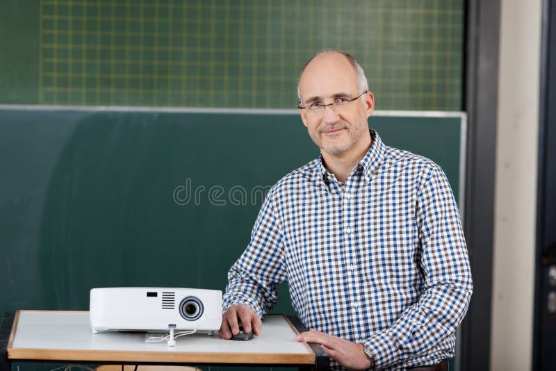 Lecturer with a slide projector stock photography