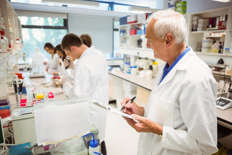 Lecturer Watching Over His Science Class Stock Photos Free & Royalty