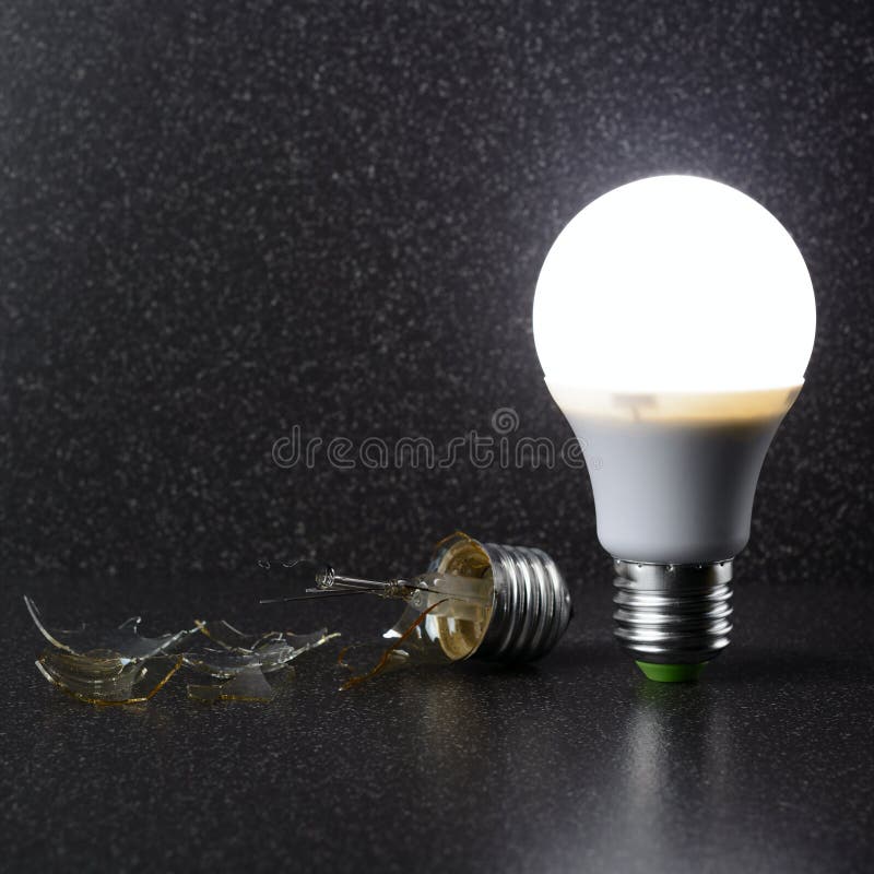 Broken Incandescent Light Bulb On Black Background. Stock Image Image