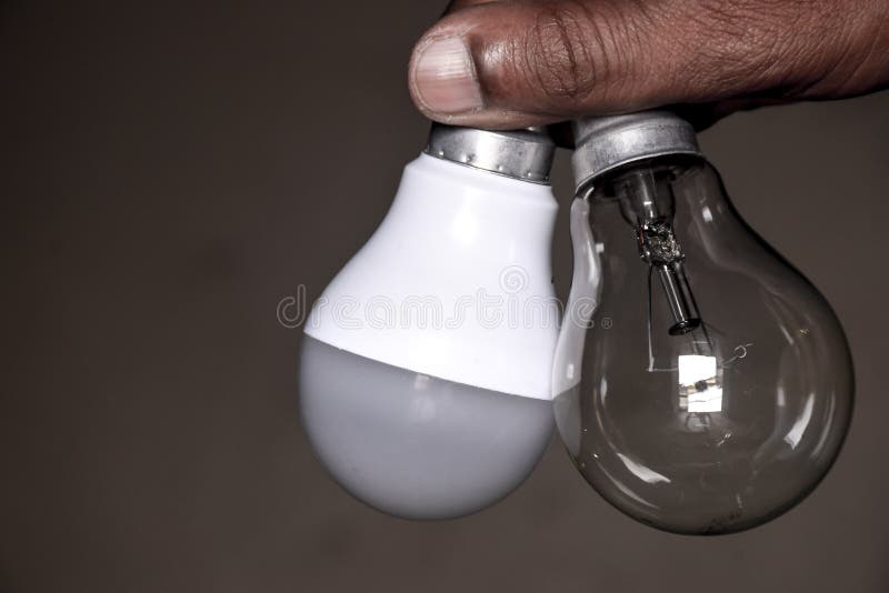 Comparing Fluorescent and Incandescent Light Bulbs Stock Photo Image