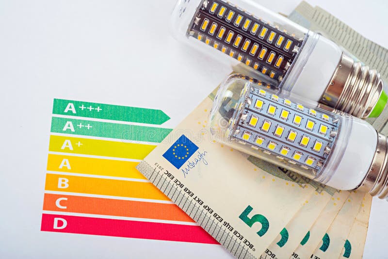 LED lamp and money. Bulb, conservation. Stock Image Everypixel