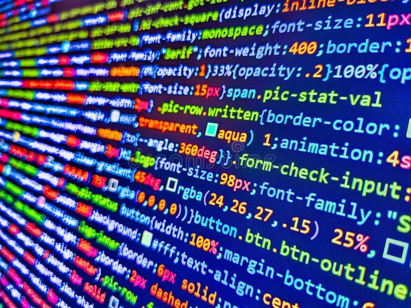 コンピュータLED画面上のウェブコードのクローズアップ。ノートパソコン画面上のHTMLコード。JavaScript、CSS、HTMLのクローズアップ。プログラマー ストック画像