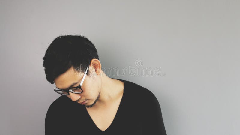 An asian man with black t-shirt. An asian man with black t-shirt.