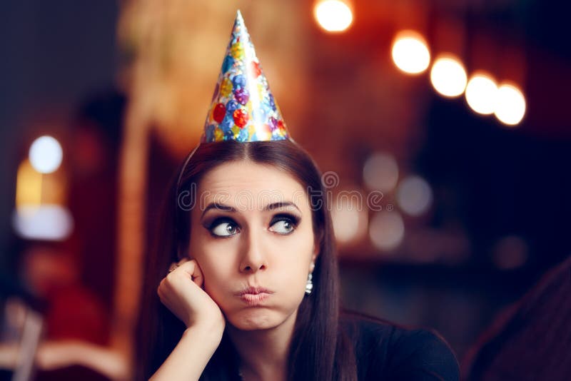 Portrait of a funny girl with party hat making faces. Portrait of a funny girl with party hat making faces