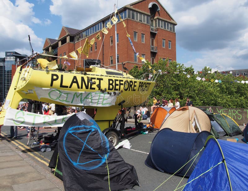 The large yellow boat tents and people in the road at the extinction rebellion protest blocking victoria bridge in leeds royalty free stock photos The large yellow boat tents and people in the road at the extinction rebellion protest blocking victoria bridge in leeds royalty free stock photos