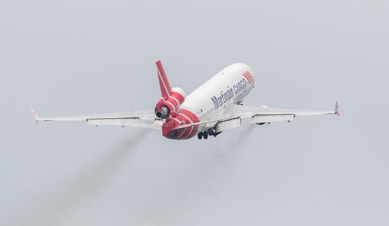 LEEUWARDEN, THE NETHERLANDS - JUNE 11, 2016: PH-MCU Martinair Holland McDonnell Douglas MD-11 during a demonstration at the Royal Netherlands Air Force Days. LEEUWARDEN, THE NETHERLANDS - JUNE 11, 2016: PH-MCU Martinair Holland McDonnell Douglas MD-11 during a demonstration at the Royal Netherlands Air Force Days