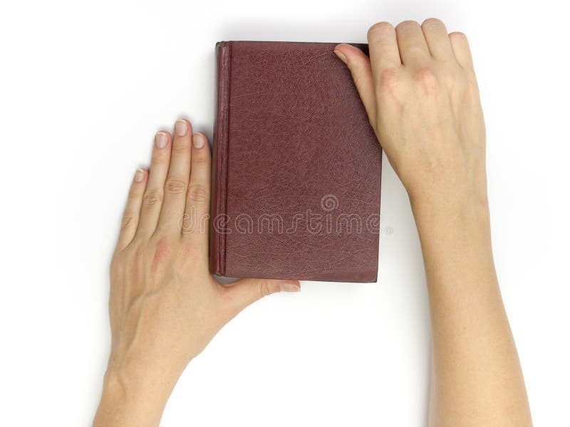 Leeg rood hardcoverboek van de handengreep op witte achtergrond royalty-vrije stock afbeelding Leeg rood hardcoverboek van de handengreep op witte achtergrond royalty-vrije stock afbeelding