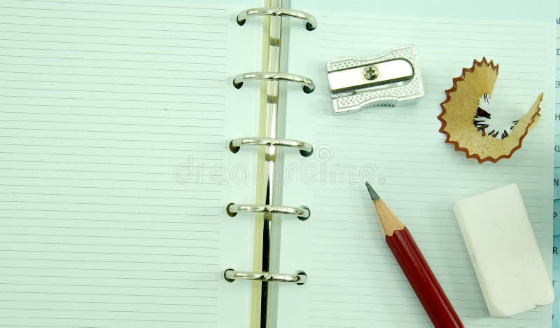 An empty notebook with pencil and eraser. An empty notebook with pencil and eraser