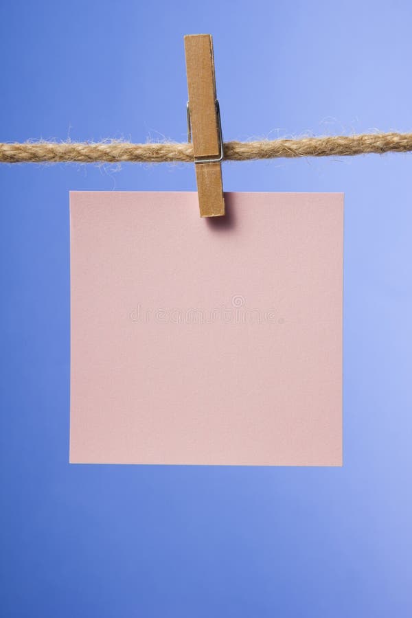 Blank paper notes hanging on rope with clothes pins, copy space for text or image or product placement. Reminder. Blank paper notes hanging on rope with clothes pins, copy space for text or image or product placement. Reminder