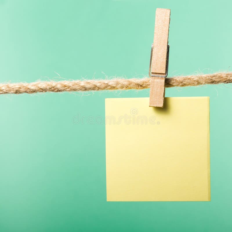 Blank paper notes hanging on rope with clothes pins, copy space for text or image or product placement. Reminder. Blank paper notes hanging on rope with clothes pins, copy space for text or image or product placement. Reminder