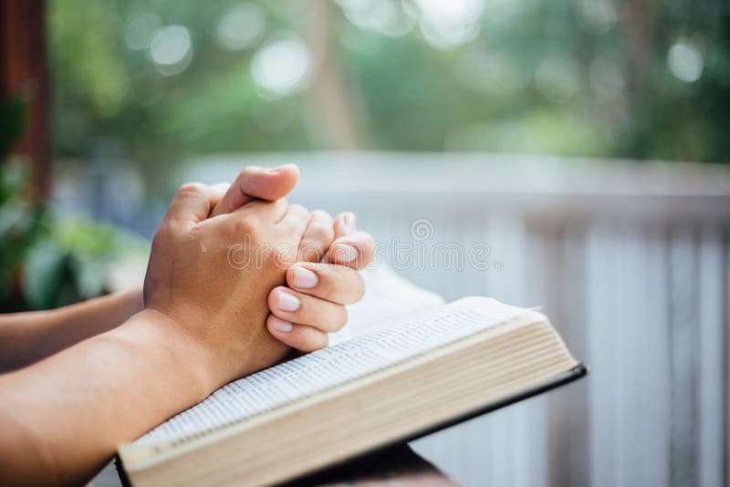 White picture read bible and praying outside at home . White picture read bible and praying outside at home .