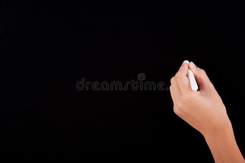 Left Hand writing on a blackboard stock images