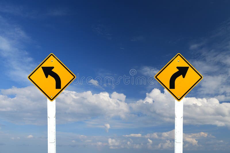 Left and right turn warning sign with blue sky stock photos