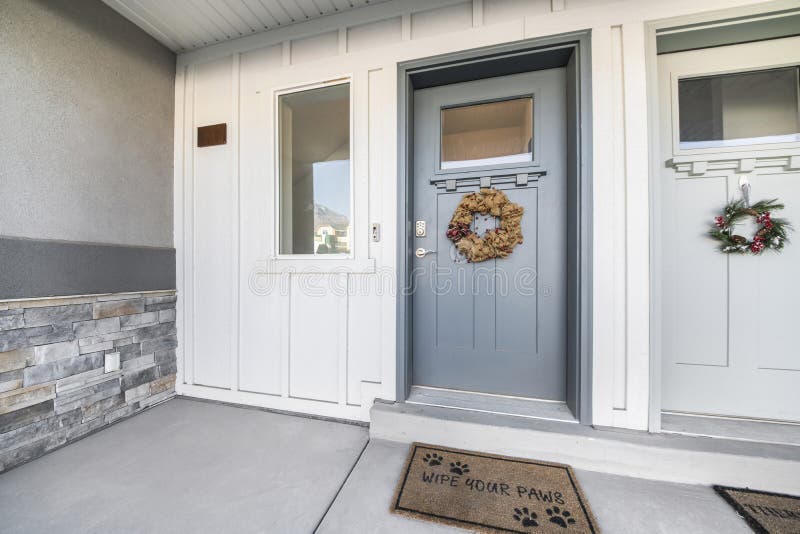 Left Side of the Two Front Doors of an Apartment Building Stock Photo