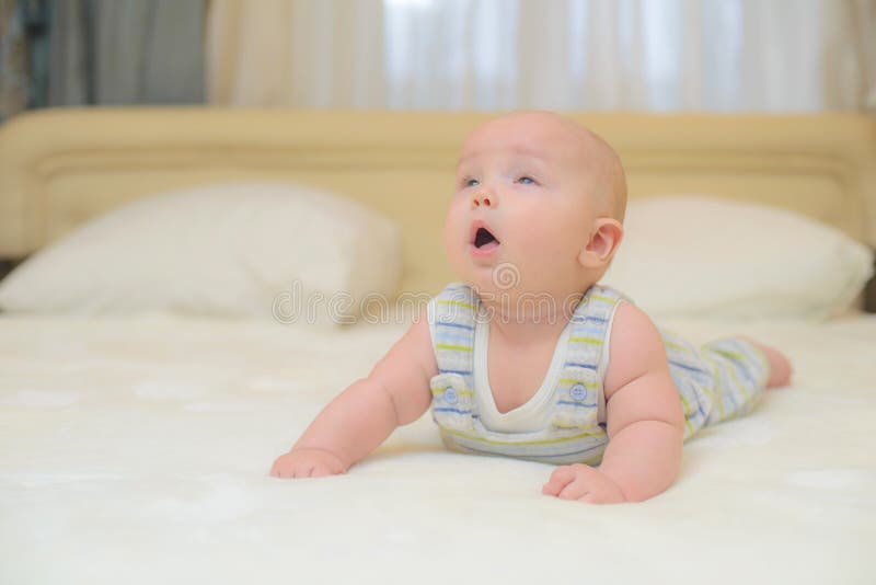 Leg little baby on the bed stock image. Image of facial 63050459