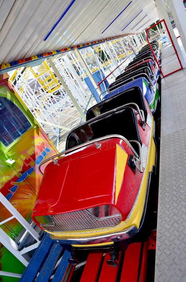 Empty chairs of a roller coaster in an amusement park. Empty chairs of a roller coaster in an amusement park.