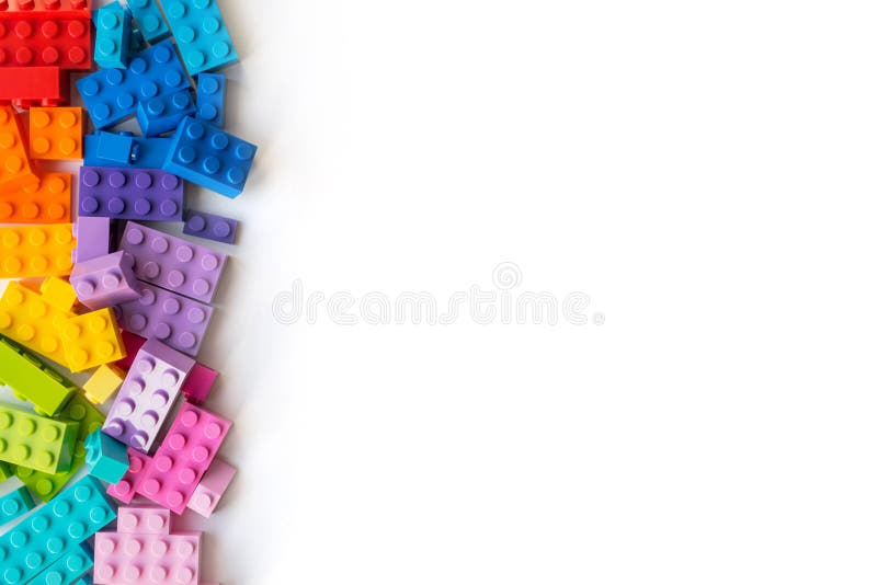 Lego bricks background. A lot of Colorful Plastick constructor bricks on white background. Popular toys. Copyspace