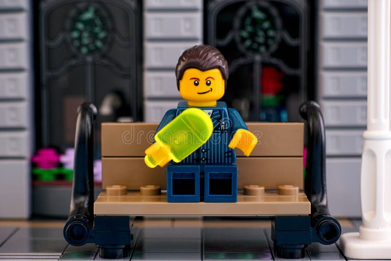 Lego Businessman Eating Ice Cream on the Bench Outside Editorial Stock - Image business, outdoors: 163417914