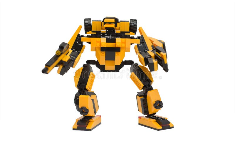 Yellow and Black Robot from Lego Assembled by Hands Isolate