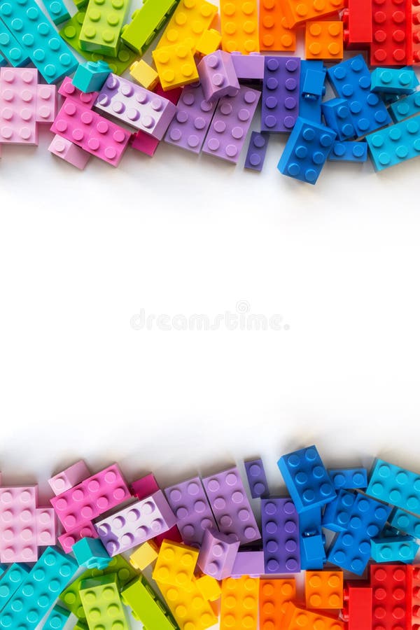 A bunch of Multicolor Plastick constructor bricks on white background. Popular toys. Copyspace. A bunch of Multicolor Plastick constructor bricks on white background. Popular toys. Copyspace