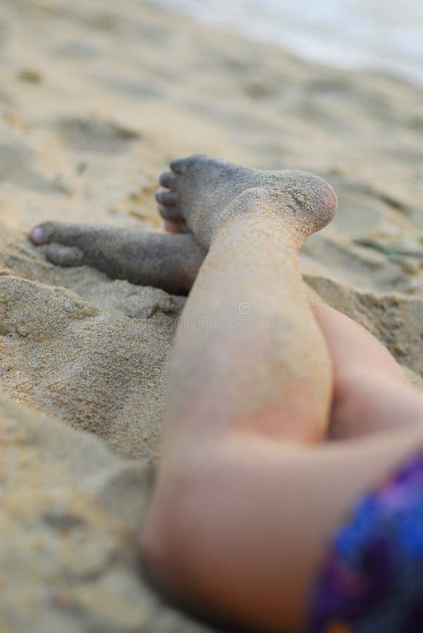 Legs on beach