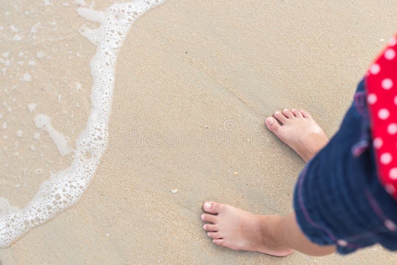 Legs of children stand on the beach royalty free stock photo Legs of children stand on the beach royalty free stock photo
