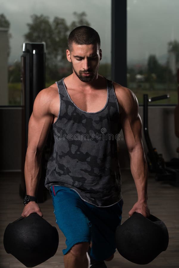 Legs Exercise with Medicine Balls in a Gym Stock Image Image of male