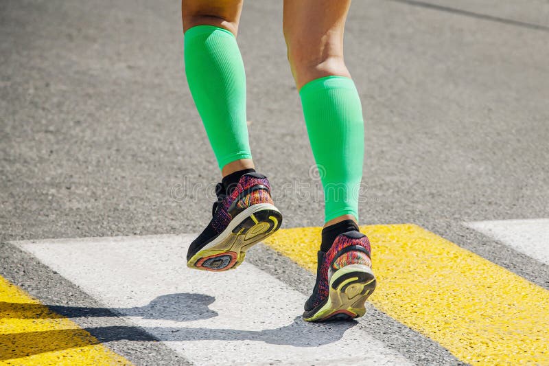 Legs Female Runner in Bright Green Compression Socks Running Stock ...