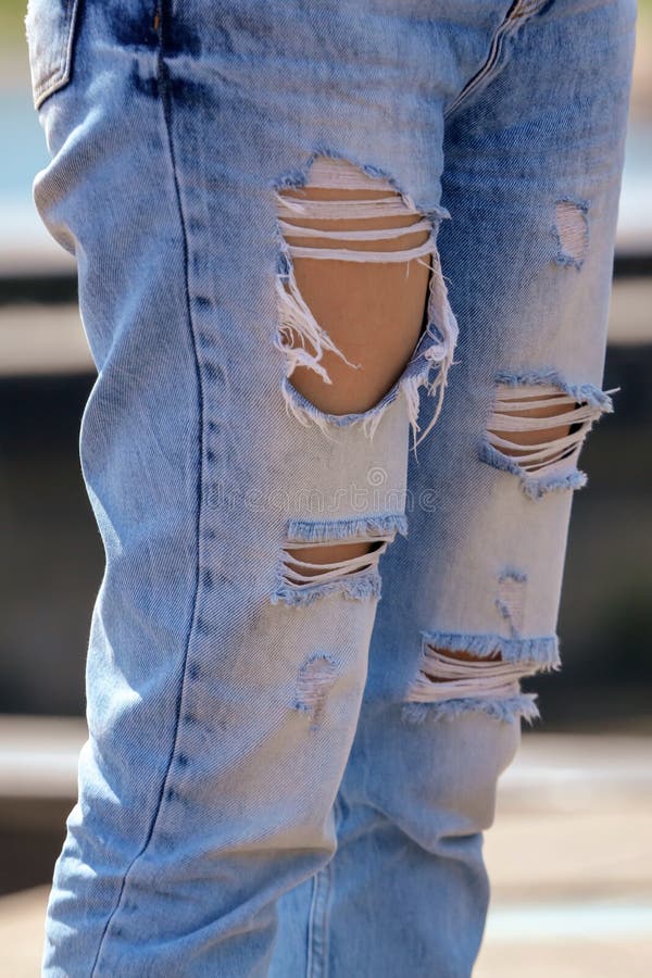Legs of a Girl in Jeans with Holes Stock Image - Image of torn, style ...