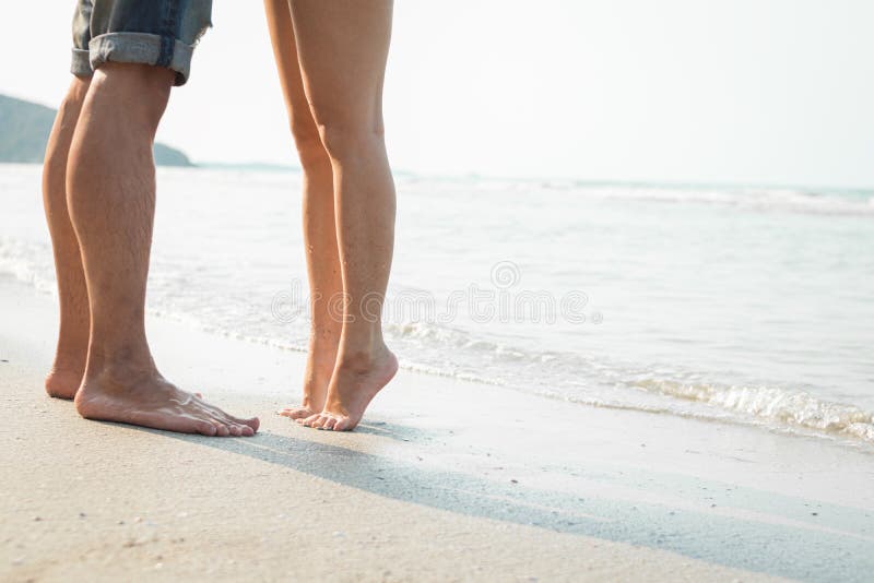 Legs of Kissing Couple on Beach. Romantic Couple on the Beach Stock ...