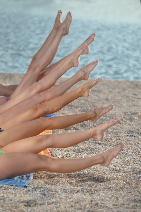 Several Girls in Bikini Lying on Sandy Beach Stock Photo Image of