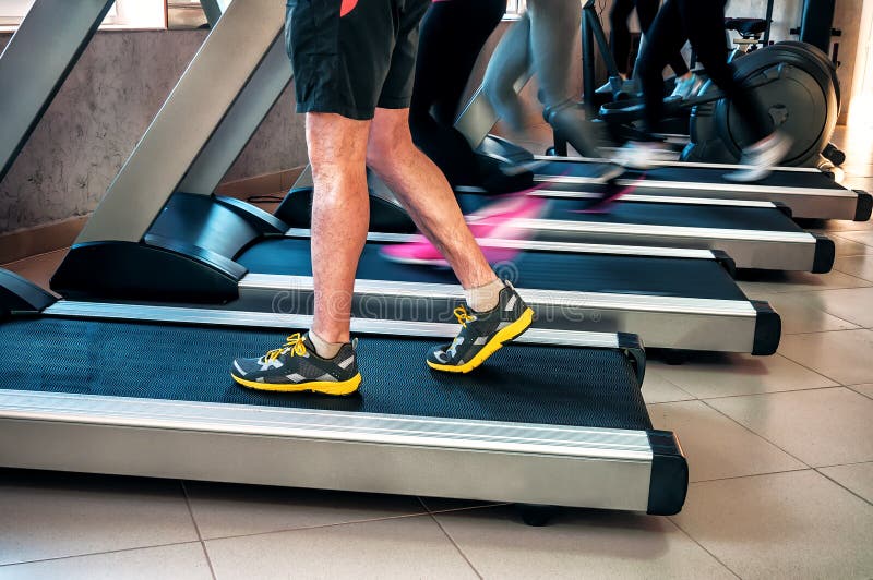 Legs on a treadmill stock photo. Image of recreational - 137220876