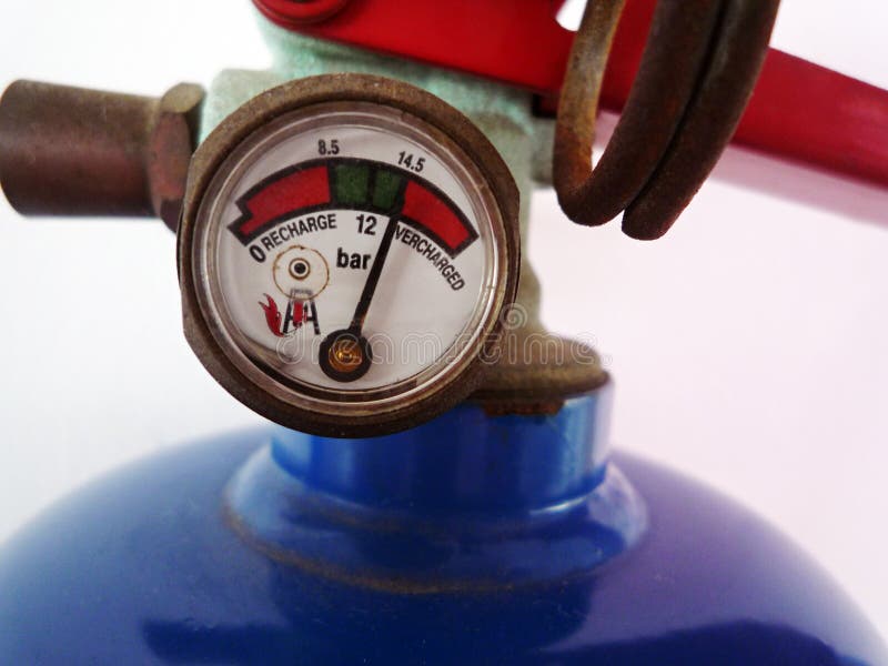 A close up image of the pressure gauge meter on a fire extinguisher. A close up image of the pressure gauge meter on a fire extinguisher.