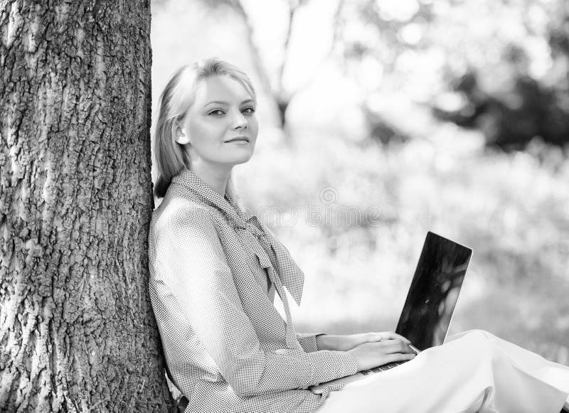 Work outdoors benefits. Woman with laptop work outdoors lean tree. Minute for relax. Girl work with laptop in park sit on grass. Education technology and internet concept. Natural environment office. Work outdoors benefits. Woman with laptop work outdoors lean tree. Minute for relax. Girl work with laptop in park sit on grass. Education technology and internet concept. Natural environment office.