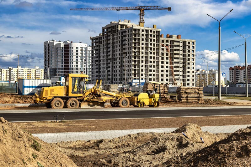 Powerful construction equipment for the construction of a new facility. Construction equipment for earthworks. Modern building site. Excavators, bulldozers, loaders, graders. Powerful construction equipment for the construction of a new facility. Construction equipment for earthworks. Modern building site. Excavators, bulldozers, loaders, graders.