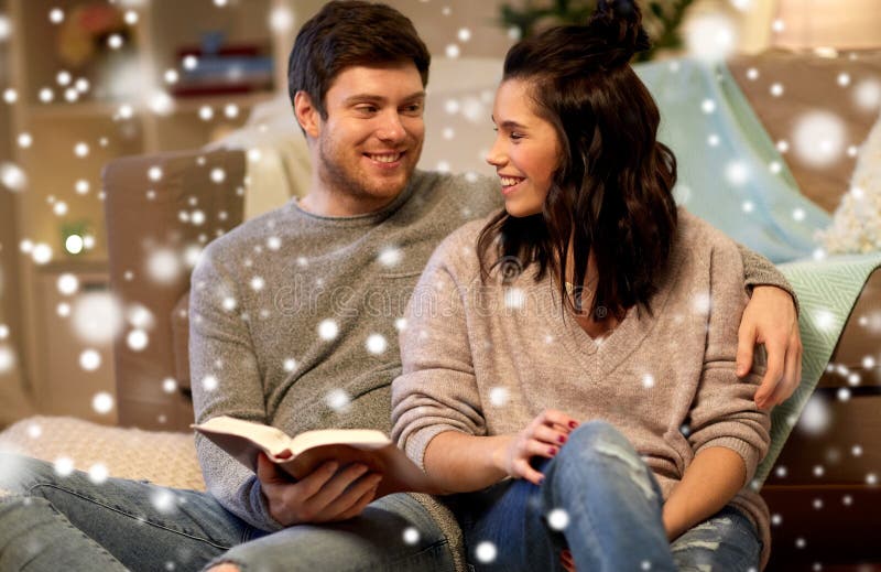 Happy couple reading book at home royalty free stock image Happy couple reading book at home royalty free stock image
