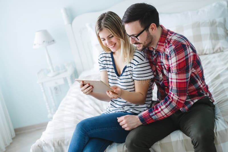 Leisurly couple in love shopping online using tablet. Leisurly couple in love shopping online using tablet