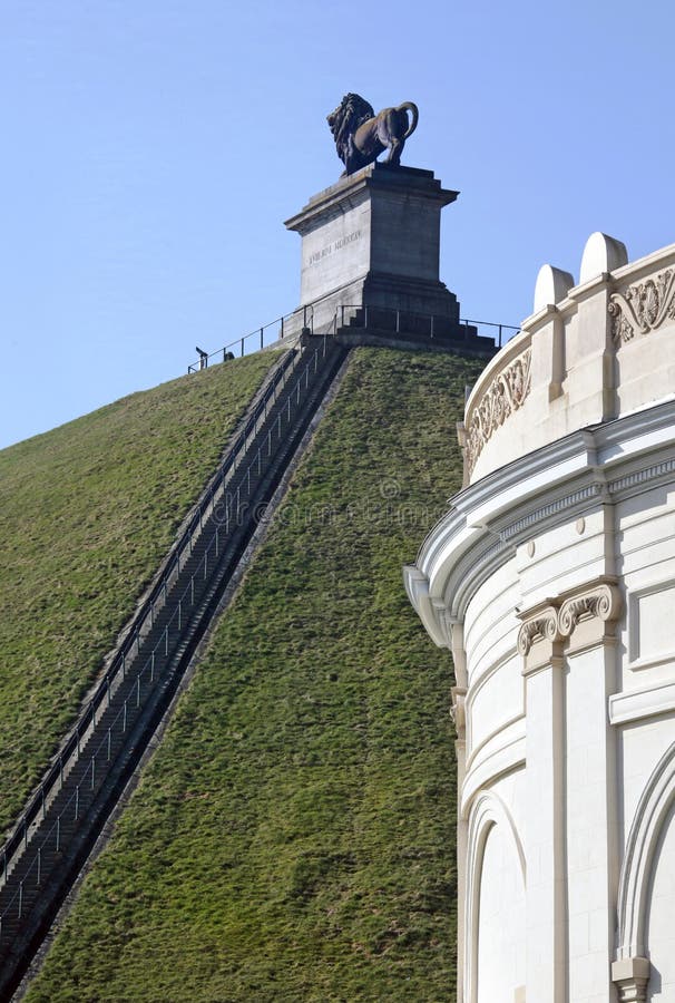 The mound is 43 m in height and has a circumference of 520 m, which dimensions would yield a volume in excess of 390,000 m³, despite the usual claim of 300,000 m³. The discrepancy might be accounted for if part of the volume is occupied by an existing volume of some topographic feature, say, the ridge of Mont-St. Jean. The Battle of Waterloo took place near Waterloo on 18 June 1815 between the First French Empire of Napoleon Bonaparte and the Alliance of the Seventh Coalition (the United Kingdom, Prussia, Austria and others), under the main allied commanders, the Duke of Wellington and General von Blucher. The mound is 43 m in height and has a circumference of 520 m, which dimensions would yield a volume in excess of 390,000 m³, despite the usual claim of 300,000 m³. The discrepancy might be accounted for if part of the volume is occupied by an existing volume of some topographic feature, say, the ridge of Mont-St. Jean. The Battle of Waterloo took place near Waterloo on 18 June 1815 between the First French Empire of Napoleon Bonaparte and the Alliance of the Seventh Coalition (the United Kingdom, Prussia, Austria and others), under the main allied commanders, the Duke of Wellington and General von Blucher.