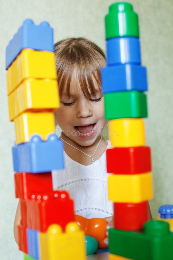 Cute child playing with the constructor bricks at home. Cute child playing with the constructor bricks at home