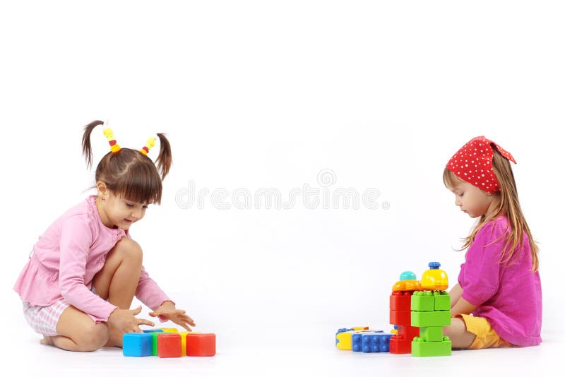 Portrait of two kids playing with constructor over white. Portrait of two kids playing with constructor over white