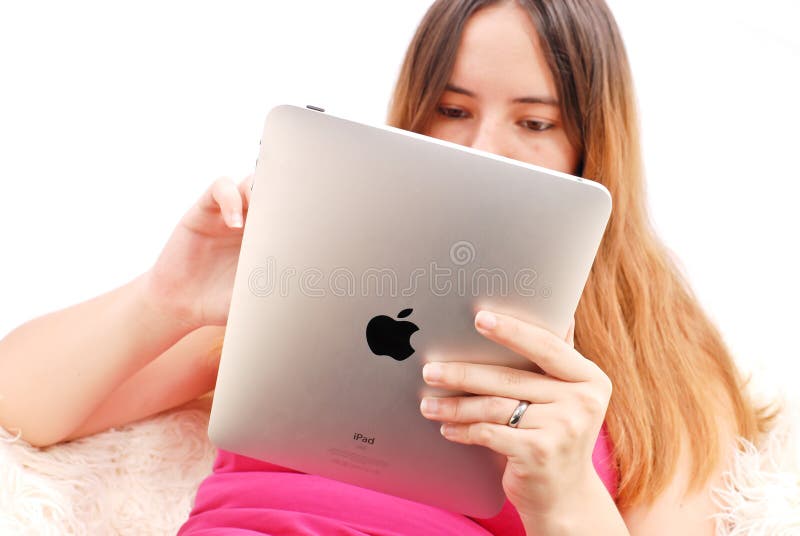 Female Playing Or Using Features Of New IOS5 On Apple Ipad. Female Playing Or Using Features Of New IOS5 On Apple Ipad