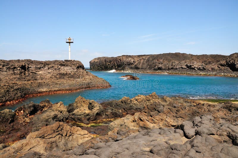 The bay of Salinas in the town of Sao Jorge on the island of Fogo, Part of Republic of Cabo Verde with its dry arid aroma during a sunny afternoon. The bay of Salinas in the town of Sao Jorge on the island of Fogo, Part of Republic of Cabo Verde with its dry arid aroma during a sunny afternoon.