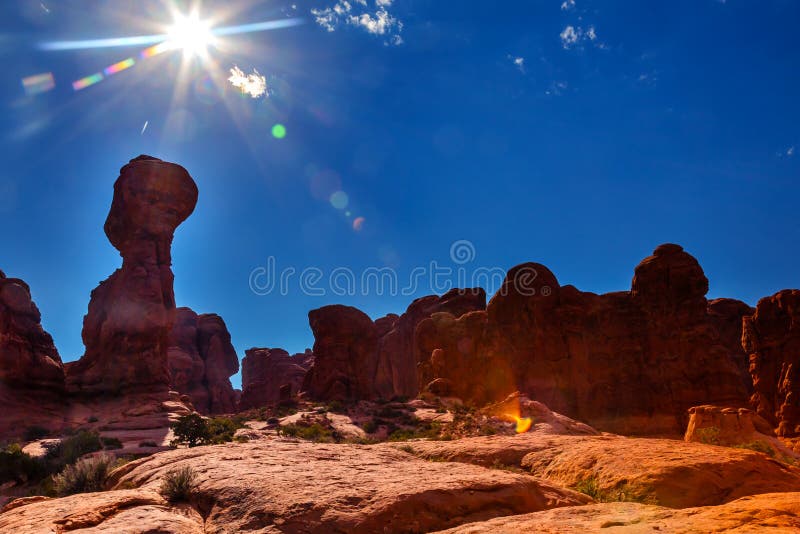 Light Flare Sun Rock Pillar Sandstone Hoodoos Garden of Eden Arches National Park Moab Utah USA Southwest. Light Flare Sun Rock Pillar Sandstone Hoodoos Garden of Eden Arches National Park Moab Utah USA Southwest.