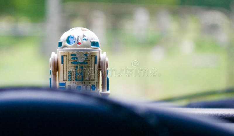 My vintage R2-D2 toy from Star Wars Episode V: The Empire Strikes Back sitting on the dashboard of my truck. My vintage R2-D2 toy from Star Wars Episode V: The Empire Strikes Back sitting on the dashboard of my truck.