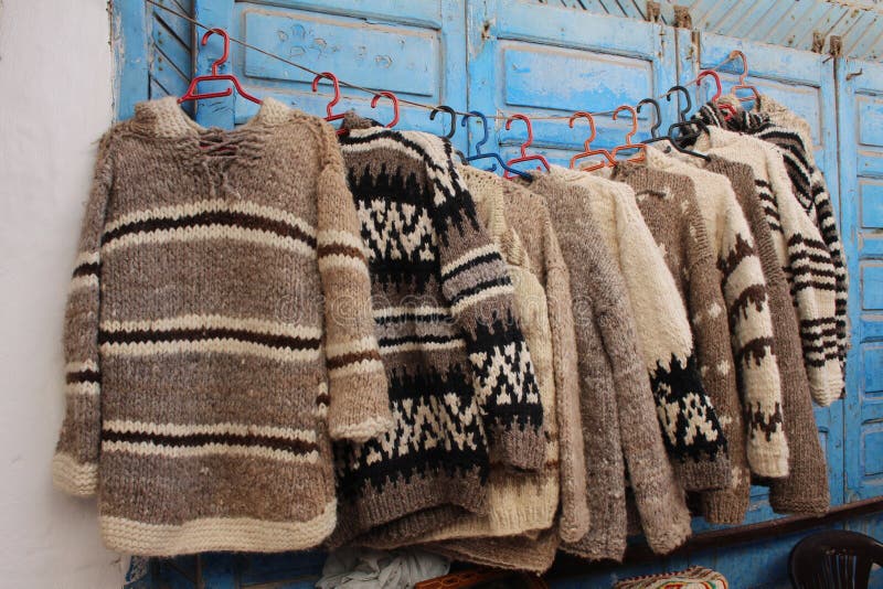 Souvenirs on display in Essaouira, Morocco: hand made wool pullovers. Souvenirs on display in Essaouira, Morocco: hand made wool pullovers