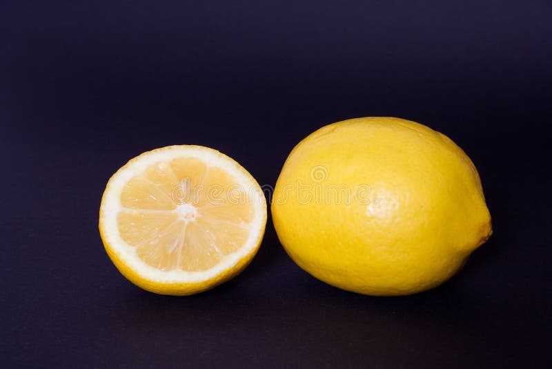 Fresh lemon isolated on black,